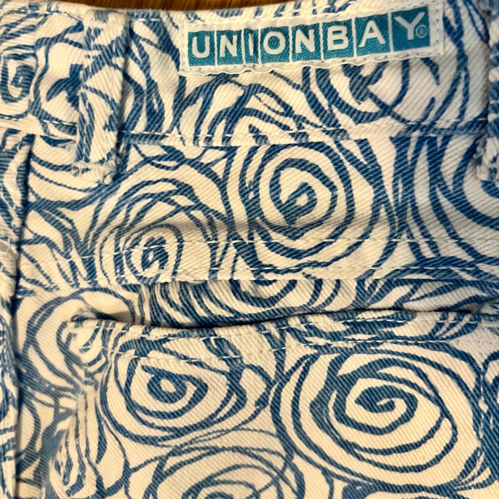 White jeans with blue rose print. I’m a 2 now so I’ve out grown them..